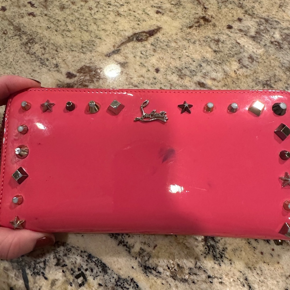 Hot pink studded Louboutin women’s wallet